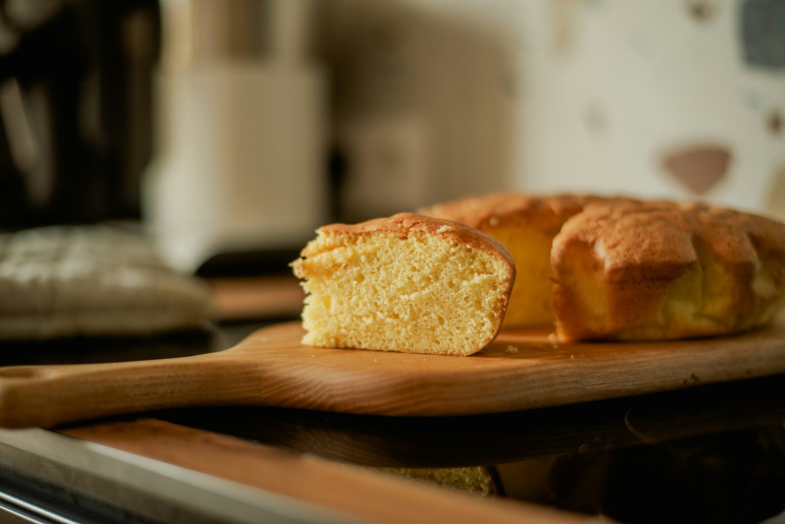 Corn Bread, A loaf of bread sitting on top of a wooden cutting board