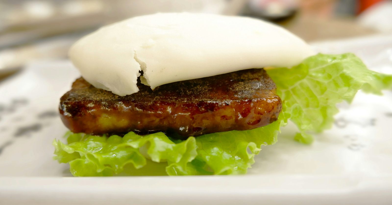 Fried Chicken Bao, a close up of a plate of food with meat and lettuce