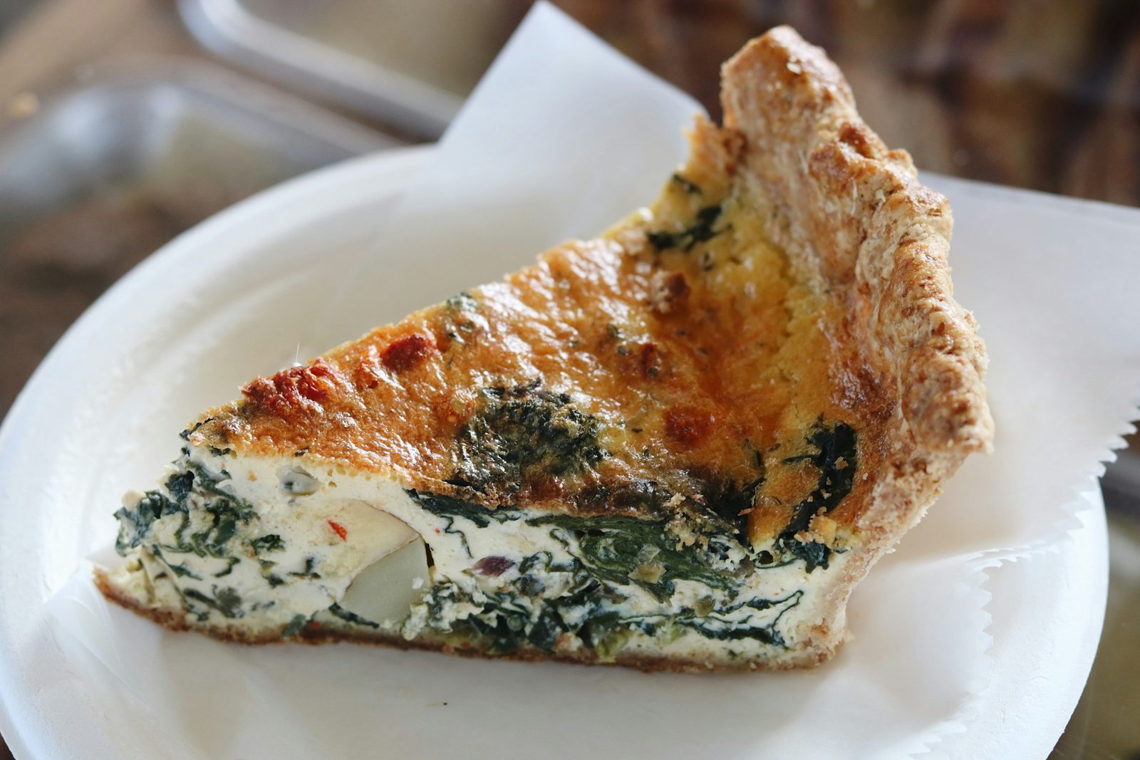 Spinach and Feta Puff Pastry, a slice of spinach and cheese quiche on a plate